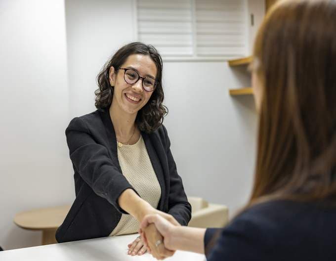 A candidate shaking hands after an interview